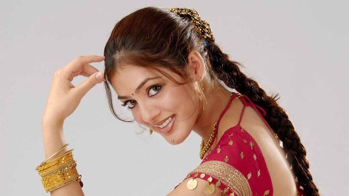 Parvati Melton Smiling Side Pose In Red Dress